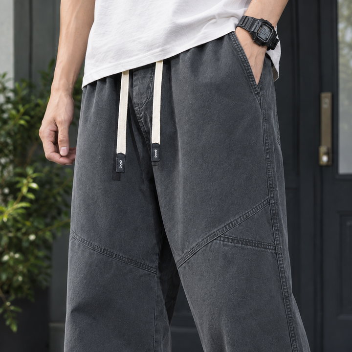 Men's relaxed straight leg cotton trousers displayed in full