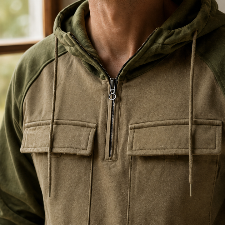 Men's grey utility hoodie showing the half-zip neckline