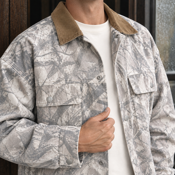 Men's camouflage denim jacket in silver grey showing its denim texture and details