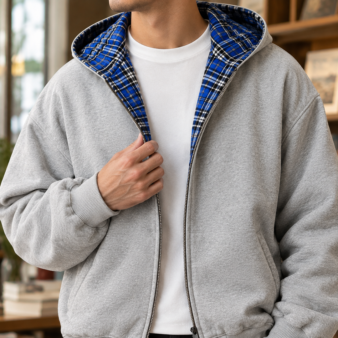 Men's reversible plaid hooded jacket displaying its hood and front fastening