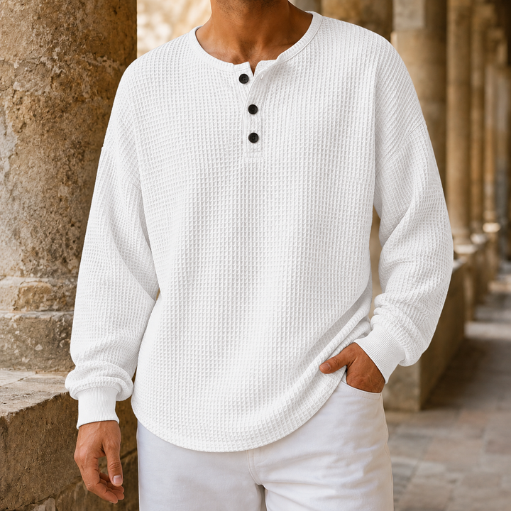Close-up of the textured waffle knit on a men's Henley sweater