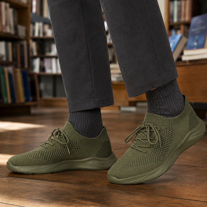 Men's knit sneaker shown from the front with a rounded toe
