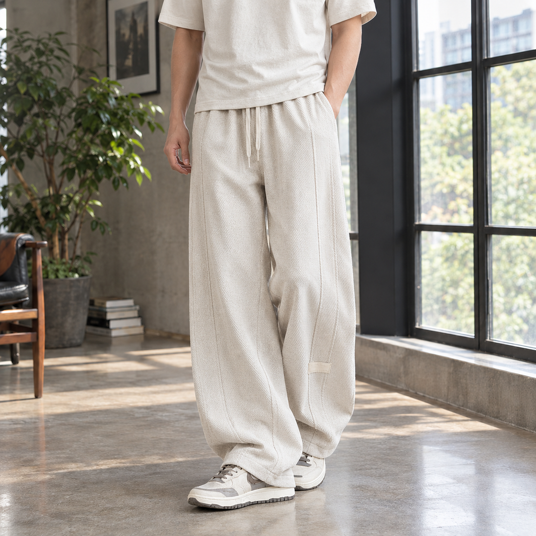 Drawstring waist detail on men's textured trousers