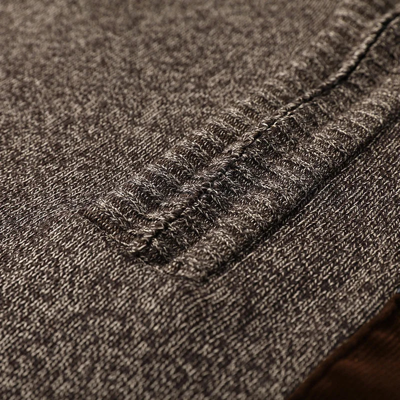 Men's cardigan displayed from the back to show its relaxed fit