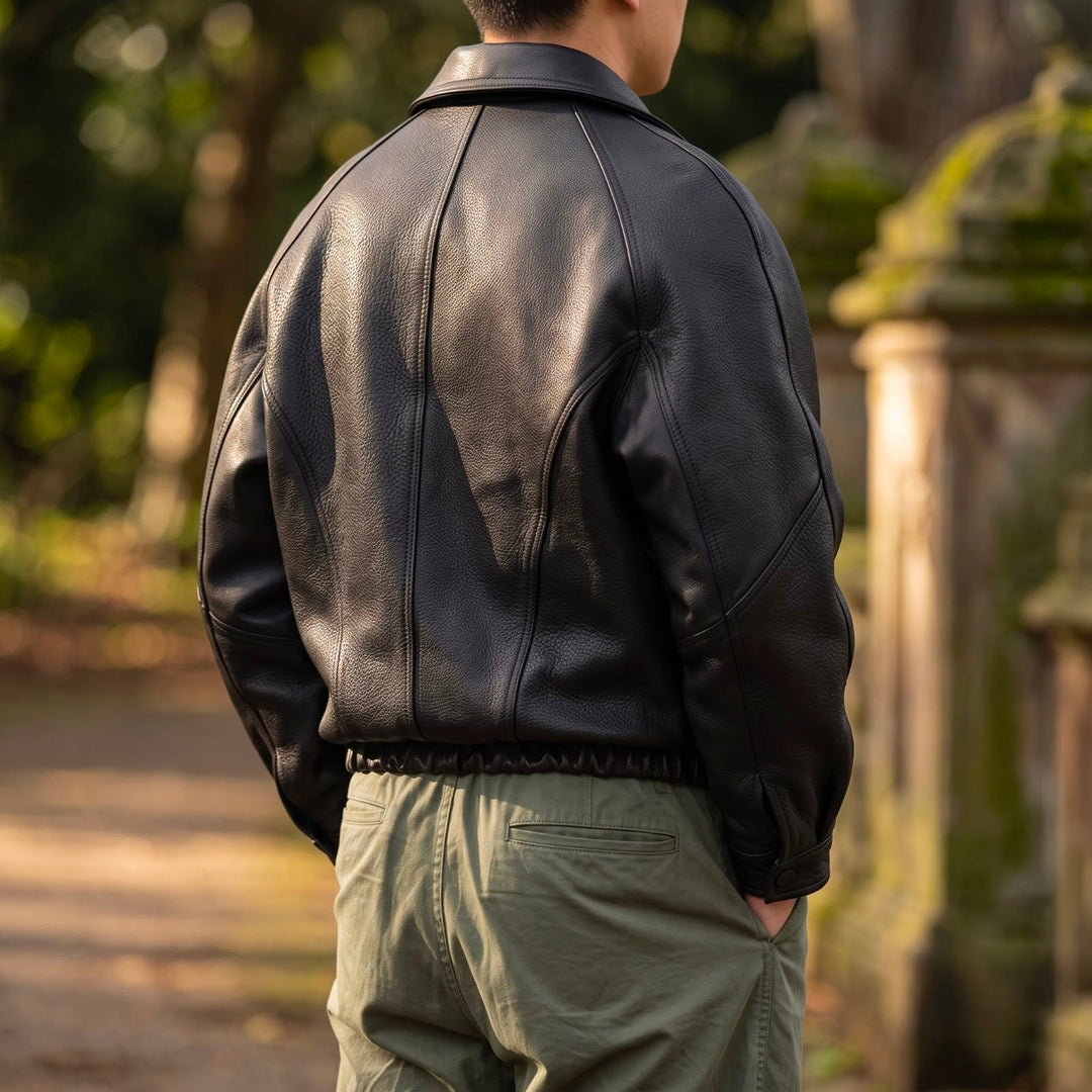 Men's leather jacket displayed from the front with a smart collar