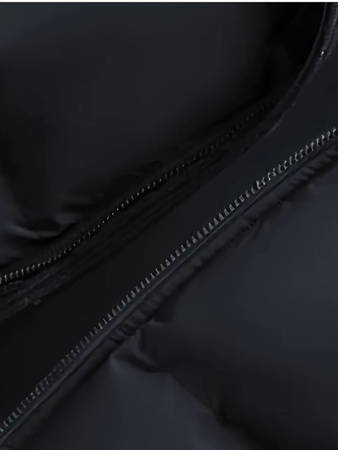 Detailed view of the hood and quilted design on a men's jacket