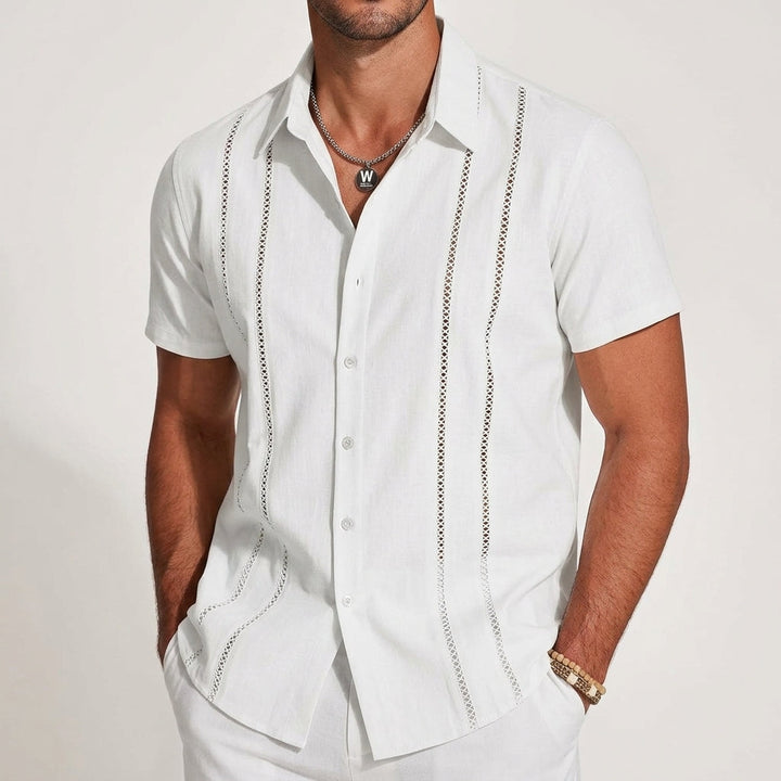 Men's relaxed fit guayabera shirt displayed flat with collar detail