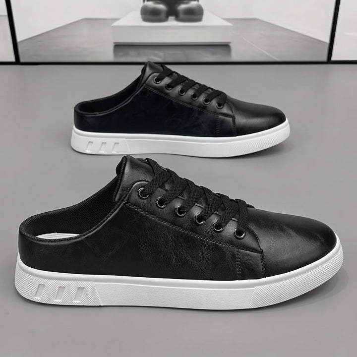 Pair of men's leather mule trainers displayed together