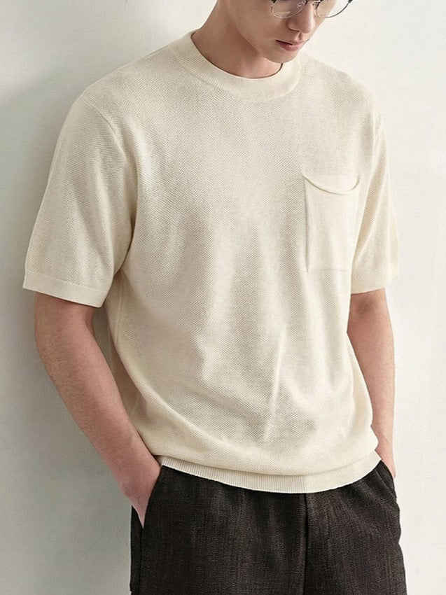 Close-up view of the textured fabric on a men's crew neck polo