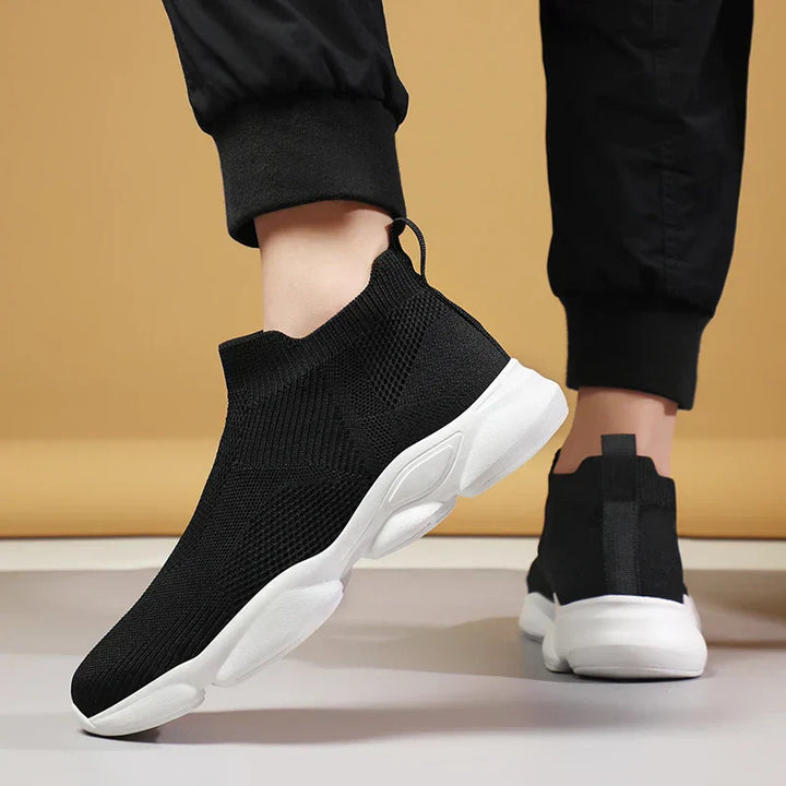 Rear view of men's black knit sock sneakers with high ankle collar