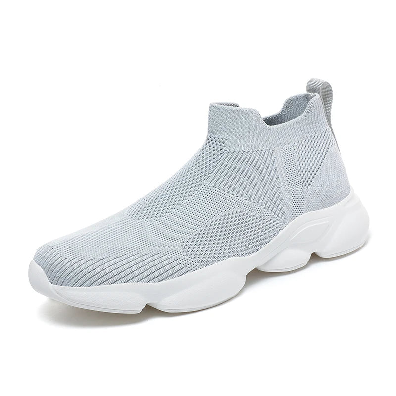 Side profile of black knit sock sneakers for men with white sole contrast