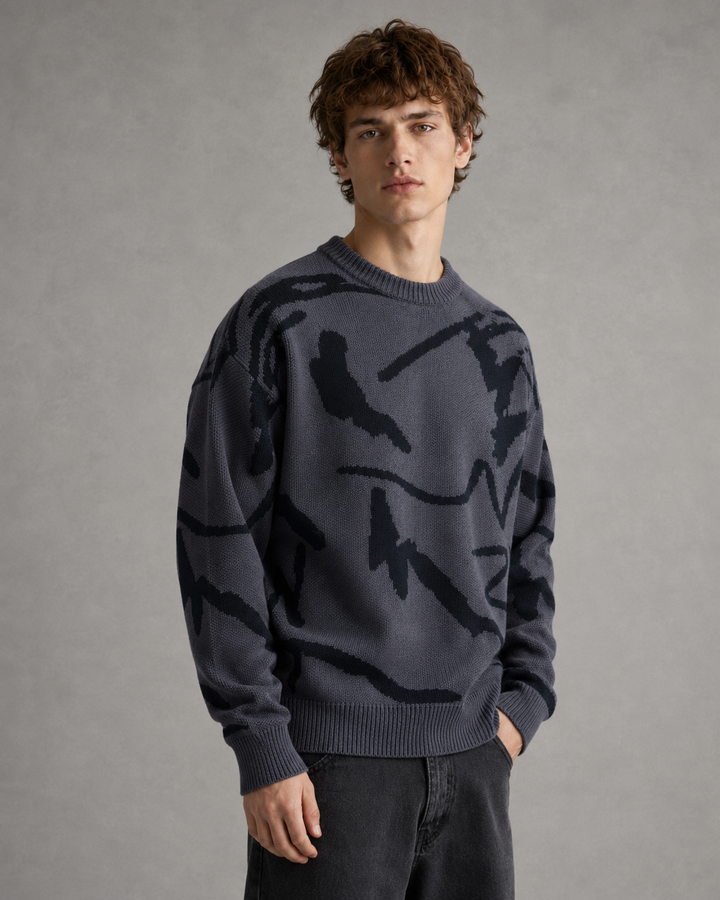 Close-up view of the knit texture and abstract graphic