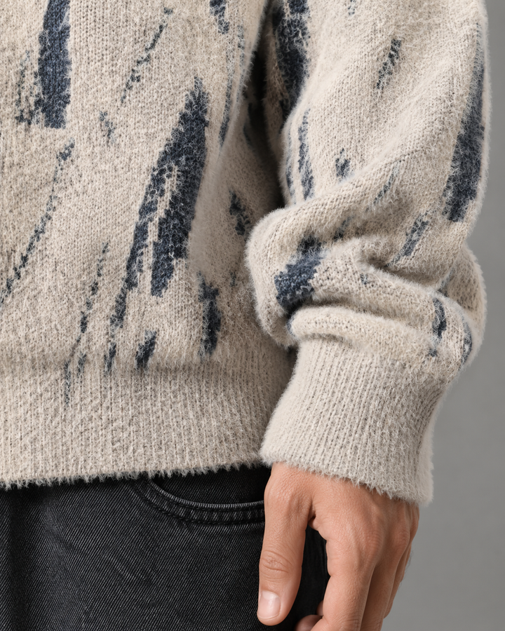 Men's abstract knit jumper showing its soft textured finish