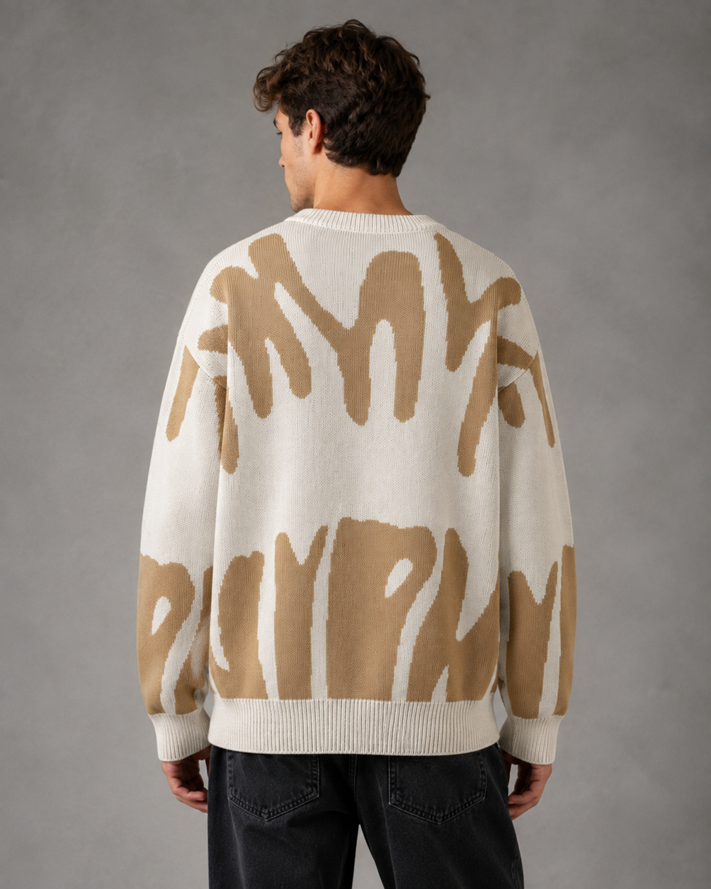 Men's relaxed-fit abstract knit jumper displayed against a plain background