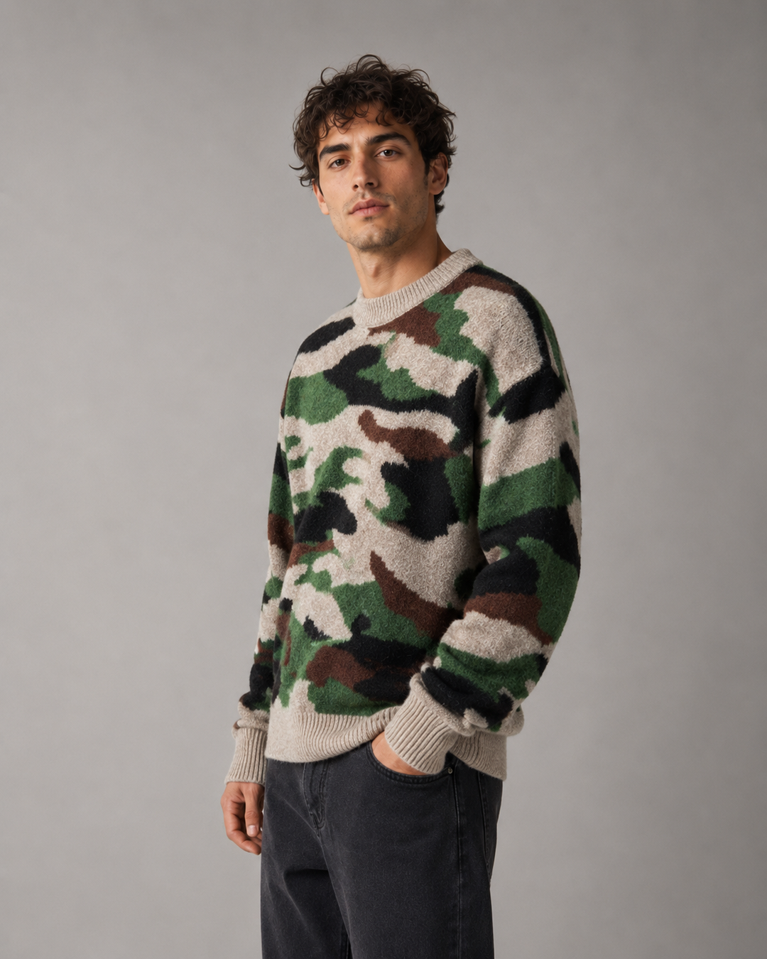 Men's camouflage knit jumper shown from the front with a relaxed crew neck fit