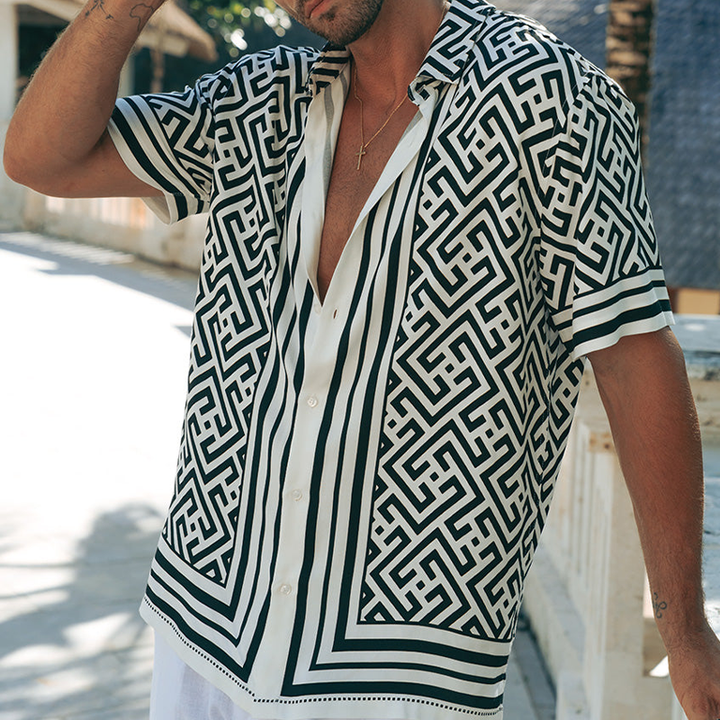 Men's geometric print shirt shown angled from the front