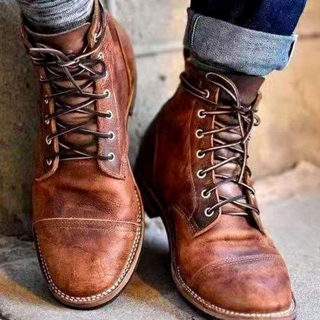Pair of men's leather-look ankle boots designed for winter wear