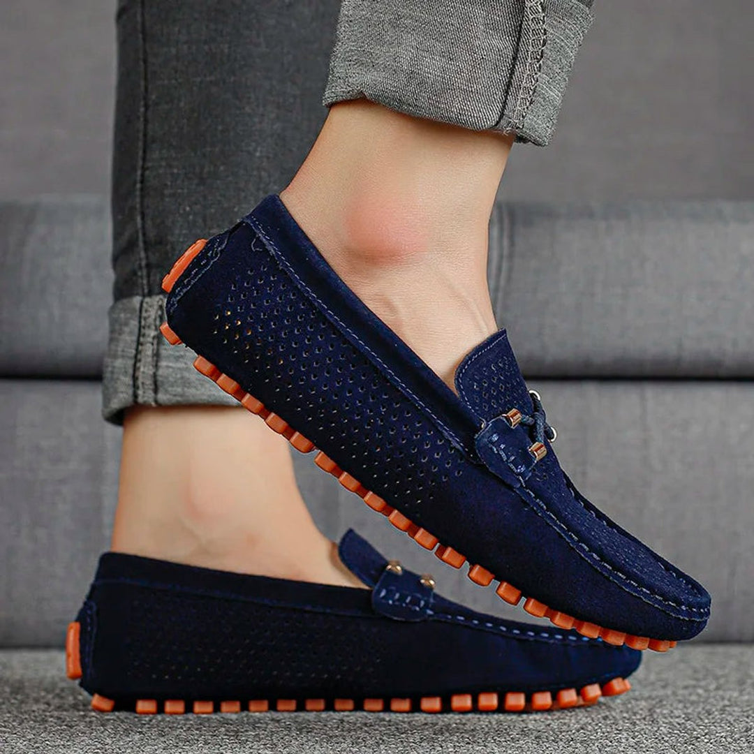 Men's perforated suede slip-on loafers shown from the side