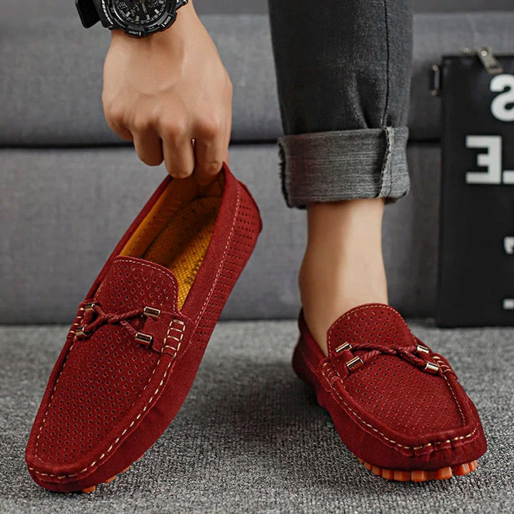 Men's perforated suede slip-on loafers shown from the back