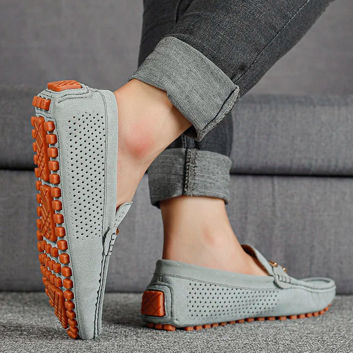 Close-up of the perforated suede upper on men's loafers