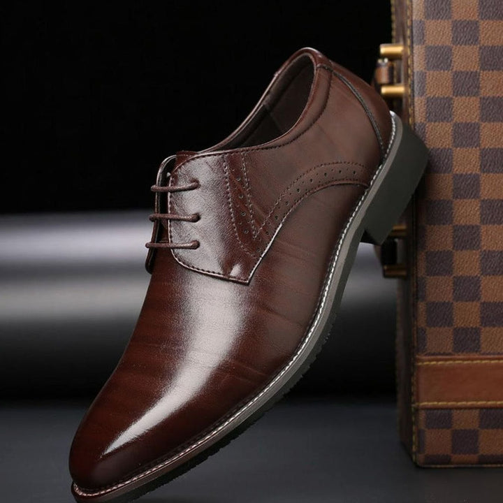 Men's polished leather lace-up brogue dress shoes shown from the front