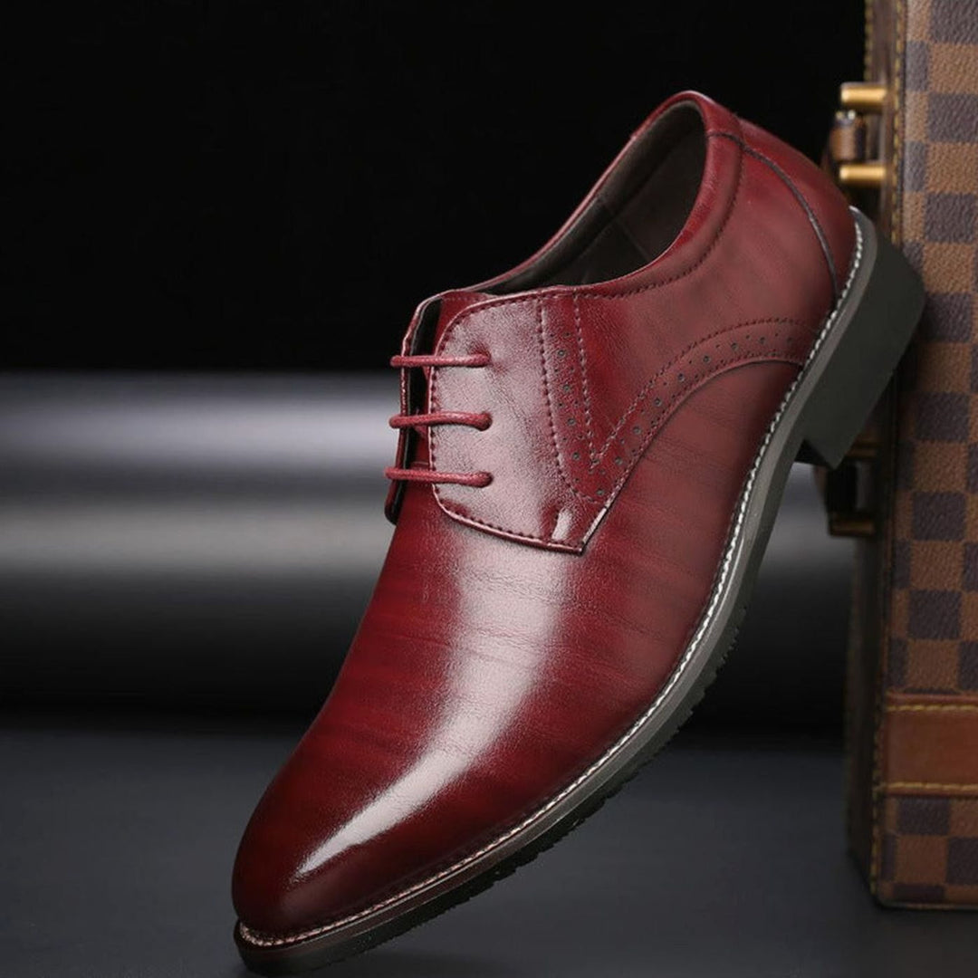 Men's polished leather brogue dress shoes displayed as a smart formal pair