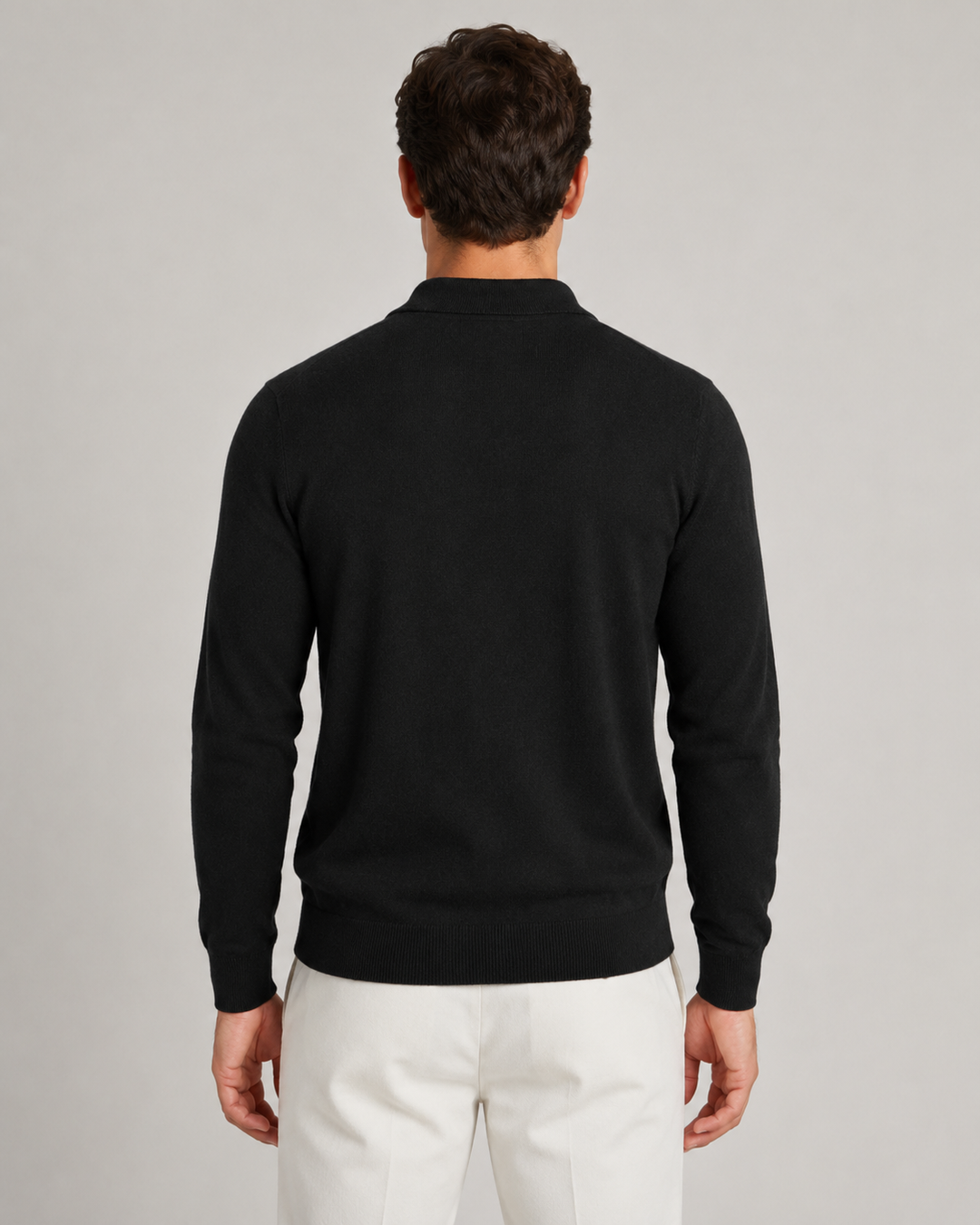 Detail of the fine-knit texture on a men's polo sweater