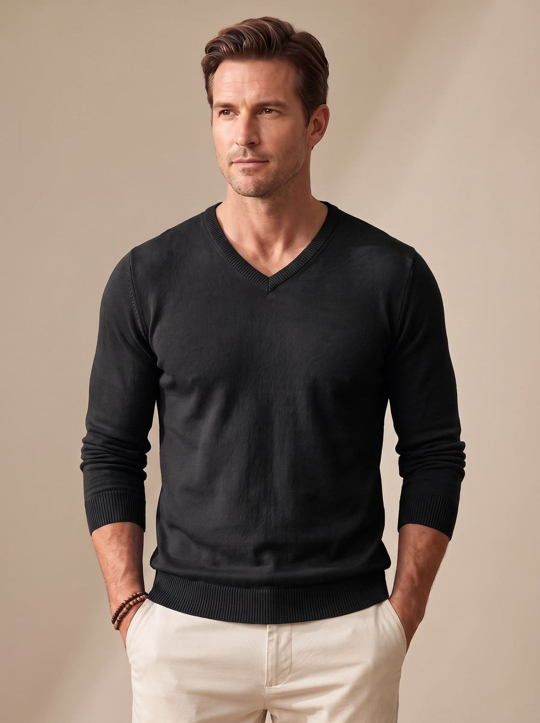 Close-up of the V-neckline on a men's fine-knit jumper