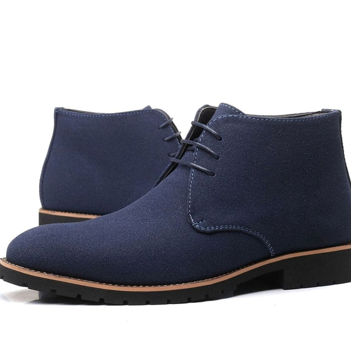 Side view of men's suede chukka ankle boots showing the ankle-height design