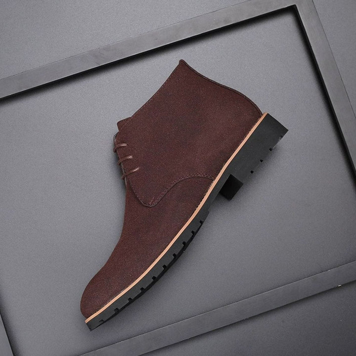 Pair of men's suede chukka ankle boots styled for casual everyday wear