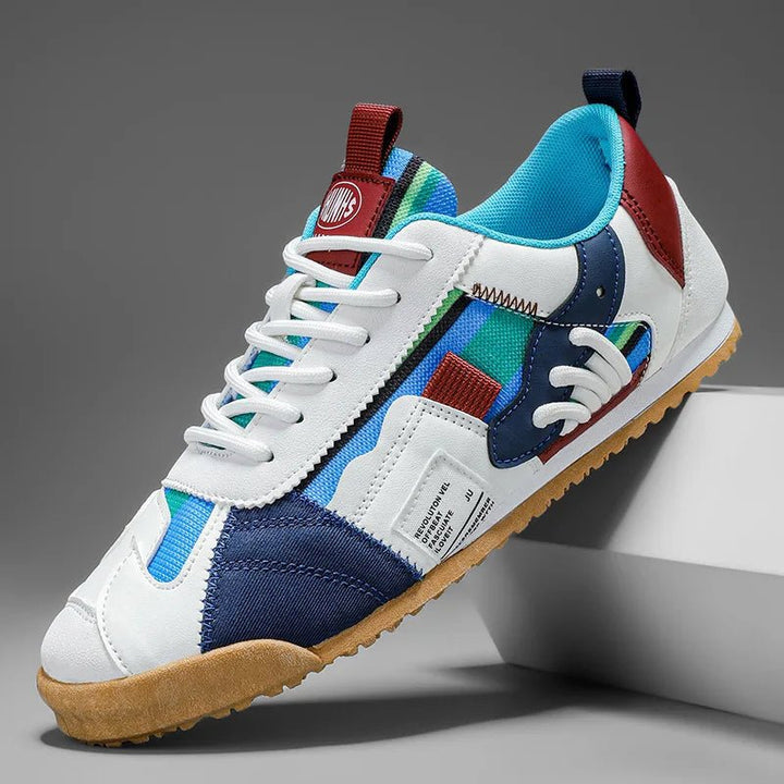 Men's layered suede mesh trail sneakers shown from the side