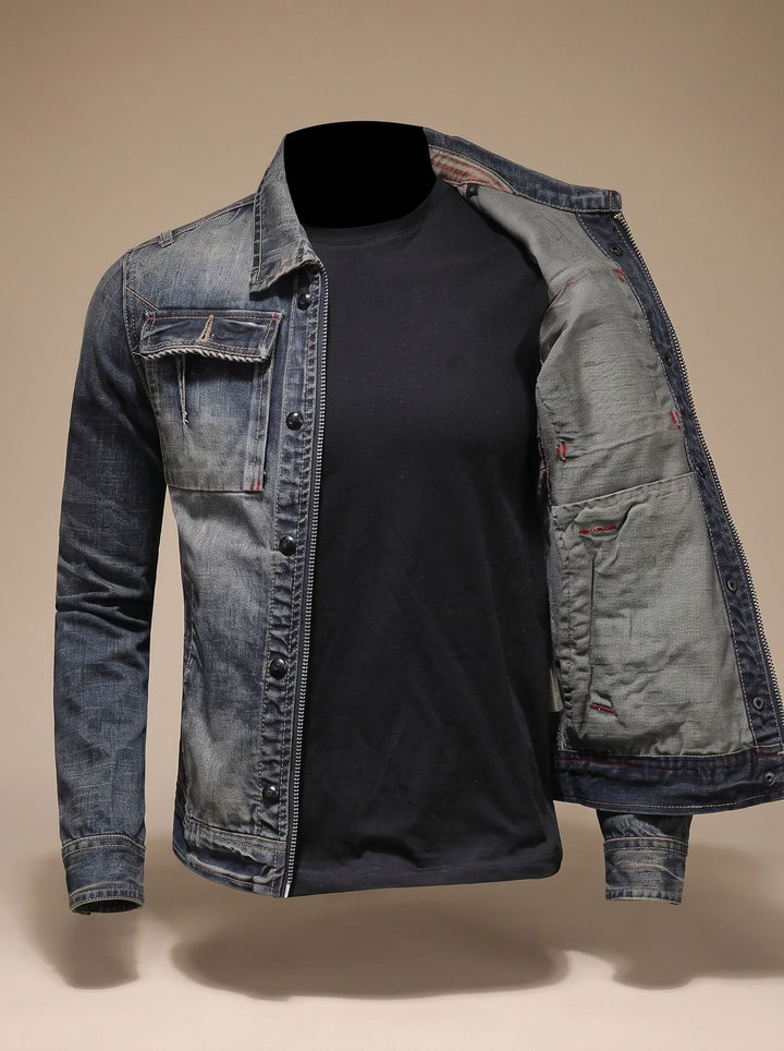 Men's denim trucker jacket displaying its structured collar and dual closures