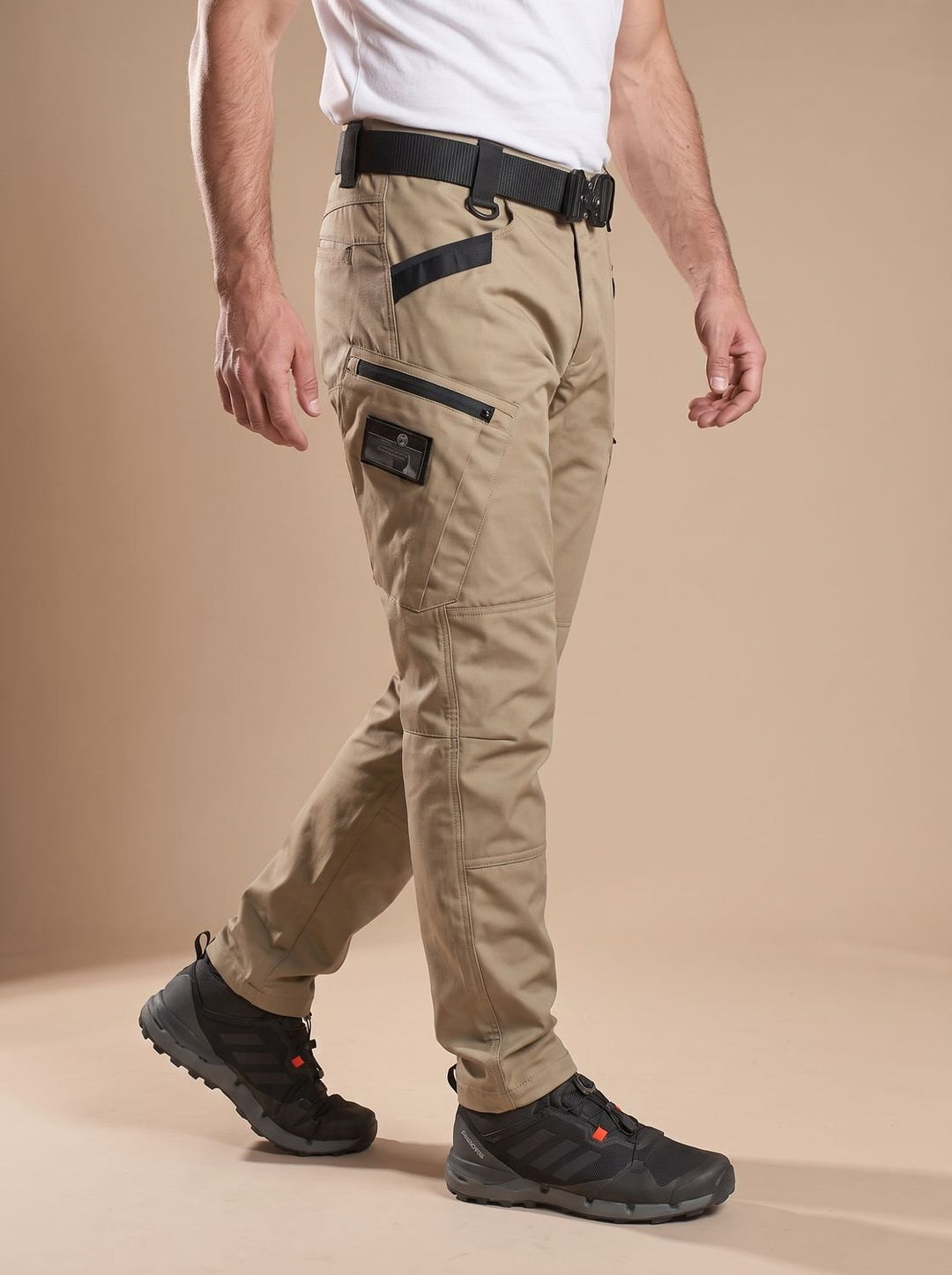 Men's water-resistant cargo trousers shown in a practical outfit