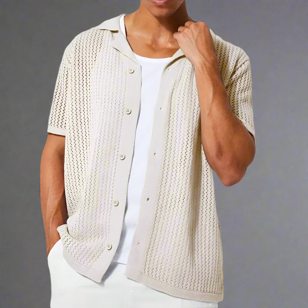 Detail view of the short sleeves and open knit construction on the shirt