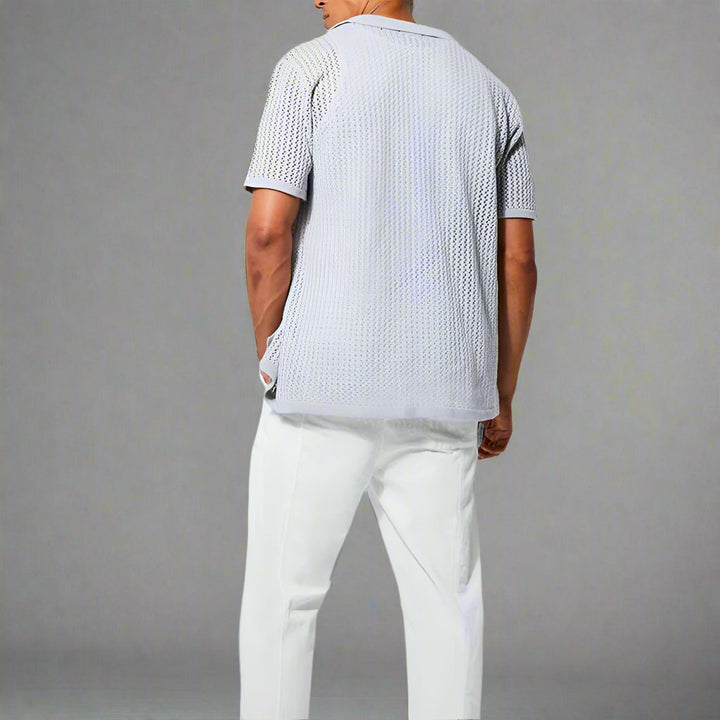 Close-up of the textured open knit fabric on the men's camp collar shirt