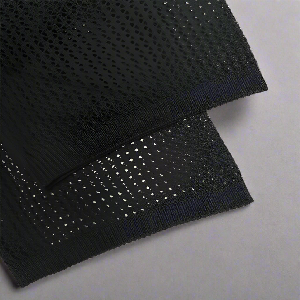 Front close-up of the camp collar and button fastening on the knit shirt
