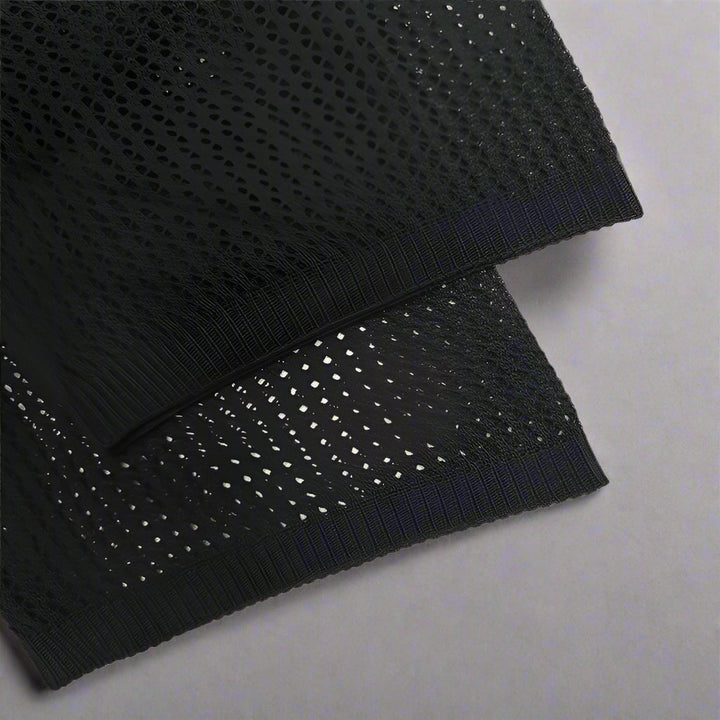 Front close-up of the camp collar and button fastening on the knit shirt