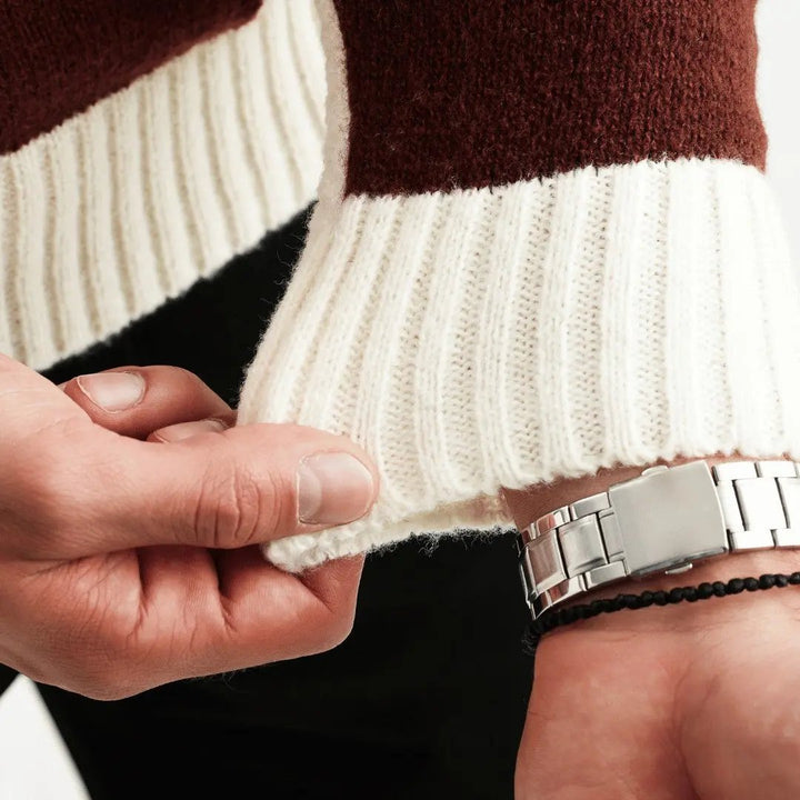 Close-up of patchwork knit texture on men's crew neck jumper