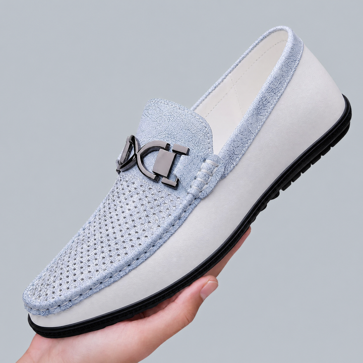 Side view of men's leather loafers with smooth leather upper