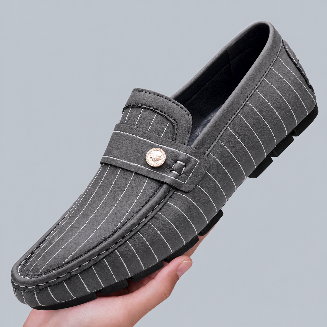 Close-up of metal detail on men's leather loafers