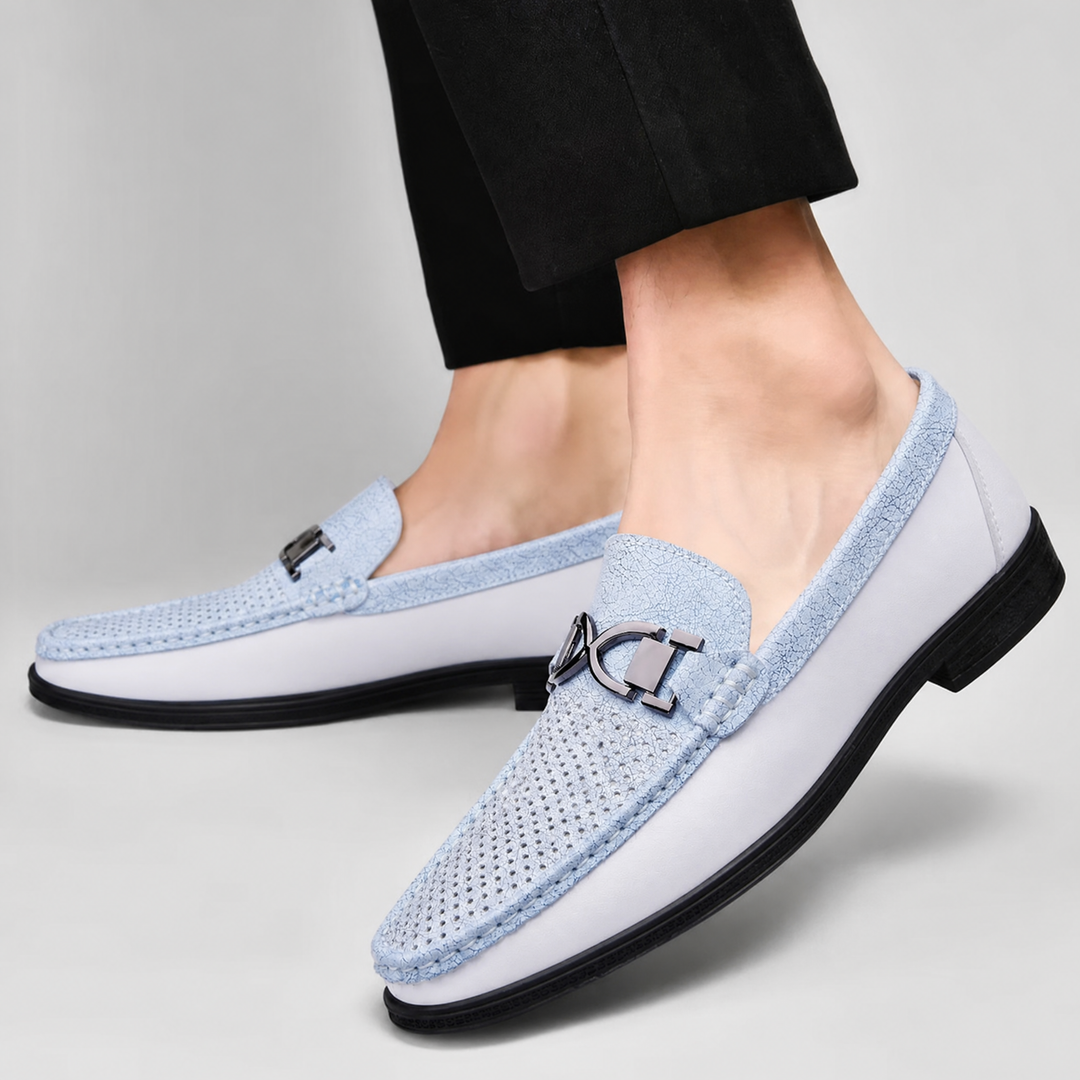 Pair of men's leather loafers highlighting the cushioned rubber sole