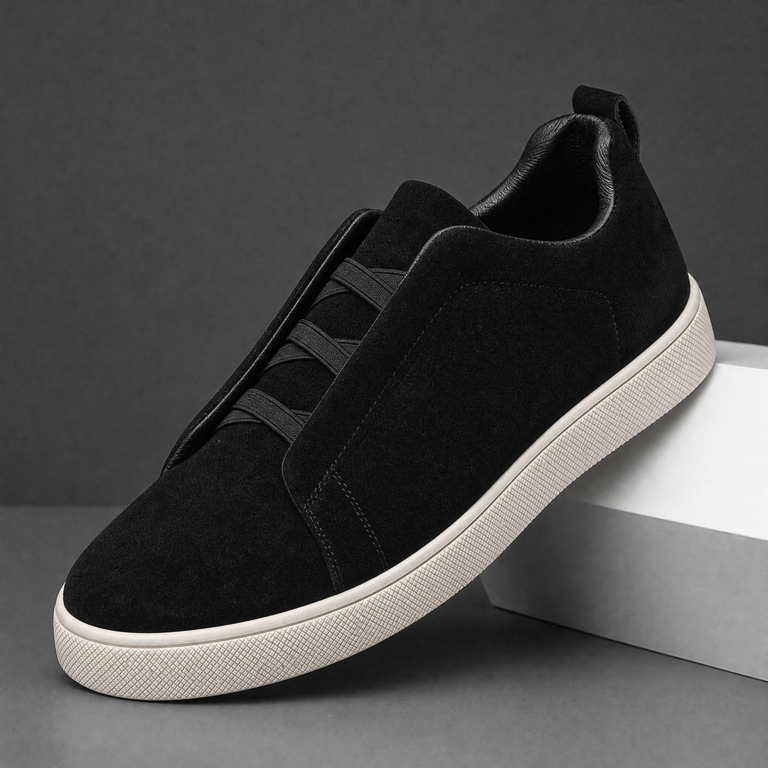 Outsole view of men's suede sneakers showing the tread pattern