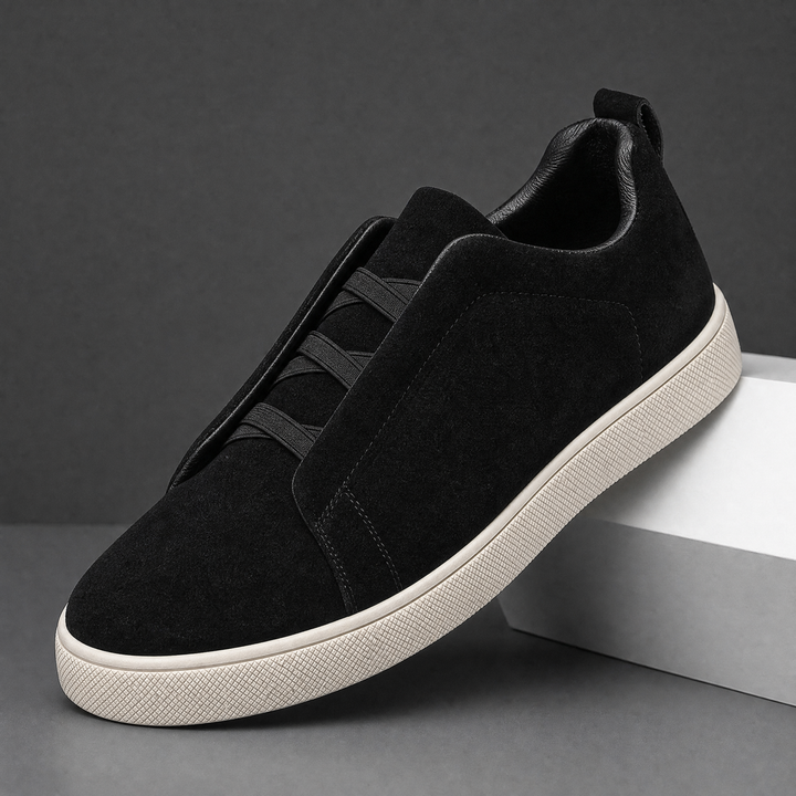 Outsole view of men's suede sneakers showing the tread pattern
