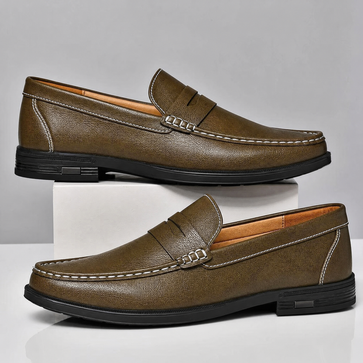 Pair of leather penny loafers positioned together