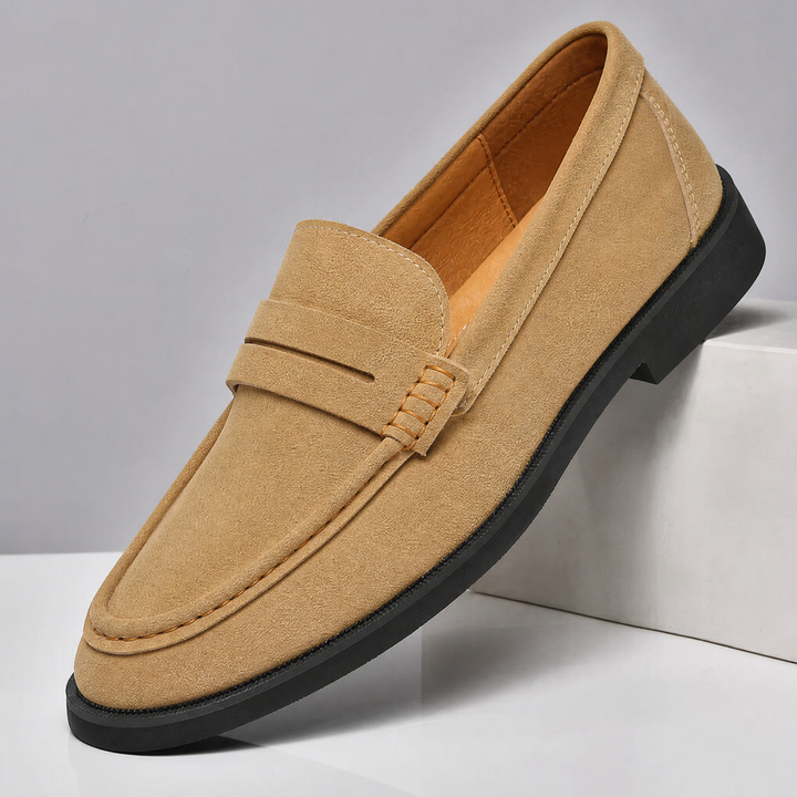 Men's suede loafers displayed as a matching pair