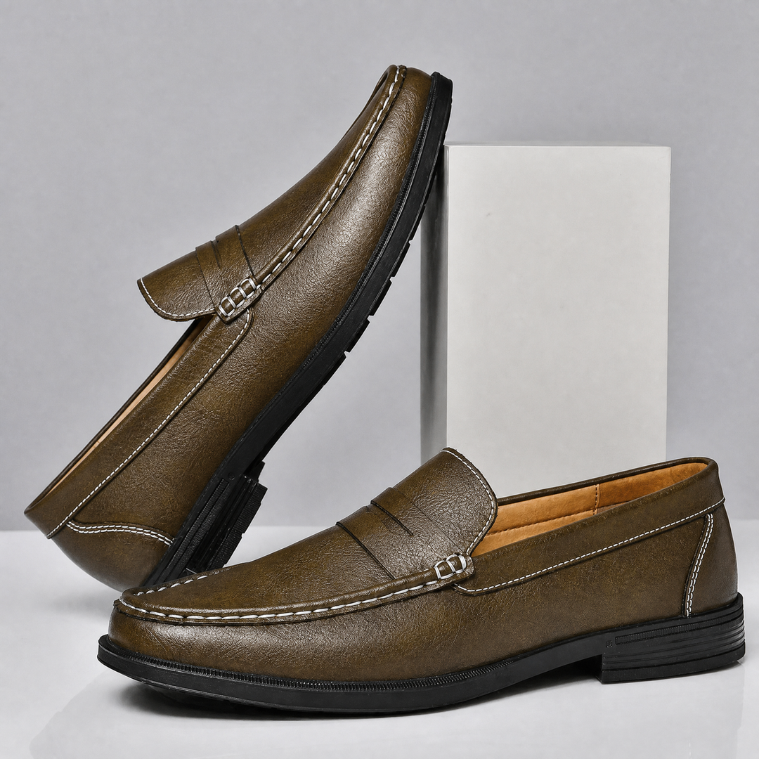 Side profile of a men's penny loafer showing its sole