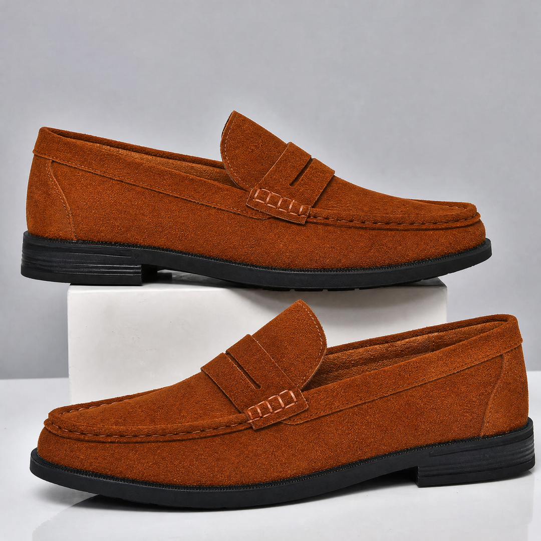 Pair of men's suede penny loafers viewed from above