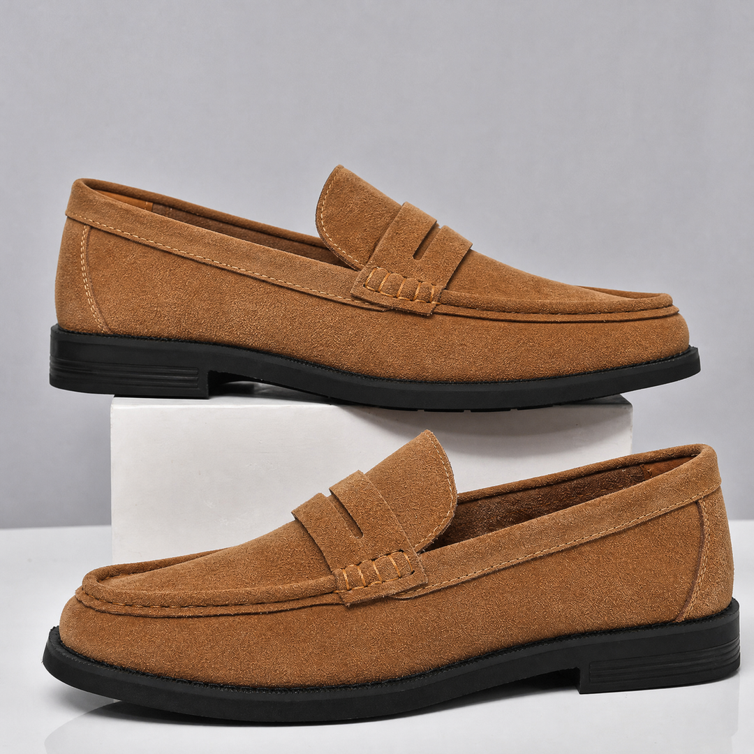 Side profile highlighting the shape of men's suede loafers
