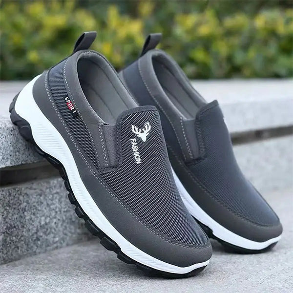 Close-up of breathable mesh fabric and cushioned sole on men's trainers