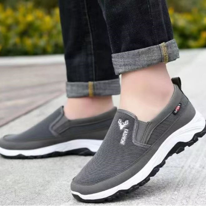 Front view of men's breathable mesh trainers with easy slip-on opening